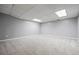 Spacious finished basement offers neutral carpet and paint and recessed lighting at 115 Bennett Farms Dr, Acworth, GA 30102