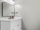 Bathroom with a white vanity, white marble countertop, and framed mirror at 115 Bennett Farms Dr, Acworth, GA 30102