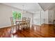 Spacious dining room with hardwood floors, staircase and large bright window at 115 Bennett Farms Dr, Acworth, GA 30102