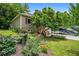 Home with a well-manicured lawn, lush gardens, and a welcoming front porch at 115 Bennett Farms Dr, Acworth, GA 30102
