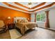 Main bedroom with coffered ceiling, ensuite, and large bright window at 115 Bennett Farms Dr, Acworth, GA 30102