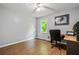 Office space with wood-look tile flooring, natural light, and desk area at 115 Bennett Farms Dr, Acworth, GA 30102