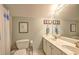 Bathroom featuring dual sink vanity and matching fixtures at 2230 Laurel Lake Dr, Suwanee, GA 30024