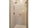 Clean shower space featuring neutral tile, showerhead, and soap dish at 2230 Laurel Lake Dr, Suwanee, GA 30024
