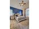 Spacious bedroom featuring vaulted ceiling, calming blue accent wall, and plush carpeting at 2230 Laurel Lake Dr, Suwanee, GA 30024