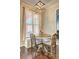 Cozy dining area featuring a built-in bench seat and natural light at 2230 Laurel Lake Dr, Suwanee, GA 30024