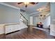 Entryway with staircase and a light-filled area featuring stylish decor and wood-look floors at 2230 Laurel Lake Dr, Suwanee, GA 30024