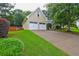 Spacious two-car garage with a driveway and well-maintained lawn, providing ample parking at 2230 Laurel Lake Dr, Suwanee, GA 30024