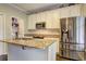 Modern kitchen with granite countertops, stainless steel appliances, and ample cabinet space at 2230 Laurel Lake Dr, Suwanee, GA 30024