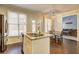 Bright eat-in kitchen with granite countertops, stainless appliances, and access to living area at 2230 Laurel Lake Dr, Suwanee, GA 30024