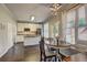 Open-concept kitchen with granite countertops, stainless steel appliances, and adjacent dining area at 2230 Laurel Lake Dr, Suwanee, GA 30024