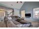 Inviting living room featuring a large sectional, vaulted ceilings, and natural light at 2230 Laurel Lake Dr, Suwanee, GA 30024