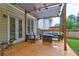 Enjoy the cozy patio with stylish pergola, complete with comfortable seating for outdoor relaxation at 2230 Laurel Lake Dr, Suwanee, GA 30024