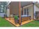 Relax on the outdoor patio under the pergola shading, which includes comfortable seating and stylish design at 2230 Laurel Lake Dr, Suwanee, GA 30024