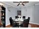 Elegant dining room with a modern chandelier, six chairs, and views to the outside at 2573 Mistletoe Ln, Snellville, GA 30039