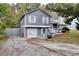 Charming two-story home featuring a gray exterior and a well-maintained front yard at 2573 Mistletoe Ln, Snellville, GA 30039