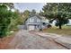 Charming two-story home featuring a gray exterior and a well-maintained front yard at 2573 Mistletoe Ln, Snellville, GA 30039