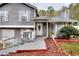 Inviting home entrance featuring a well-maintained yard and charming front porch at 2573 Mistletoe Ln, Snellville, GA 30039