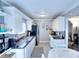 Bright kitchen featuring white cabinets, stainless steel appliances, and eat-in dining area at 2573 Mistletoe Ln, Snellville, GA 30039