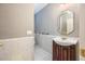 Small bathroom with modern vanity and sink, and clean tiling, for a streamlined space at 6065 Standard View Dr, Duluth, GA 30097