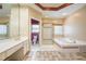 Large bathroom with a soaking tub, shower with glass door and dual sink vanity at 6065 Standard View Dr, Duluth, GA 30097