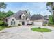Charming single-Gathering home featuring circular drive, well-manicured lawn and two-car garage at 6065 Standard View Dr, Duluth, GA 30097