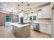 Updated kitchen featuring an island cooktop, stainless steel appliances, and bright white cabinets at 6065 Standard View Dr, Duluth, GA 30097