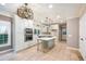 Modern kitchen with an island, pendant lighting, stainless steel appliances, and white cabinets at 6065 Standard View Dr, Duluth, GA 30097