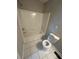 A full bathroom features tiled floors and walls, with a standard shower-tub combo and toilet at 1457 Richland Road Southwest, Atlanta, GA 30310
