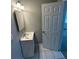 Bathroom featuring a modern vanity, tile floor, large mirror, and modern lighting at 1457 Richland Road Southwest, Atlanta, GA 30310