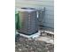 A modern AC unit outside the home next to a green garbage can at 1457 Richland Road Southwest, Atlanta, GA 30310