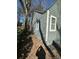This lovely home features gray horizontal siding, white trim, and multiple windows for an appealing exterior look at 1457 Richland Road Southwest, Atlanta, GA 30310
