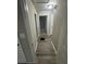 A hallway leads to other rooms, showcasing the home's neutral color palette and laminate flooring at 1457 Richland Road Southwest, Atlanta, GA 30310