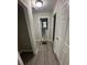 Hallway with wood-look floors leading to the bathroom at 1457 Richland Road Southwest, Atlanta, GA 30310