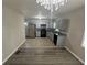 Charming kitchen with stainless steel appliances, gray cabinets, and granite countertops at 1457 Richland Road Southwest, Atlanta, GA 30310
