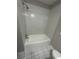A full bathroom features tiled floors and walls, with a standard shower-tub combo at 1457 Richland Road Southwest, Atlanta, GA 30310