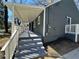 Exterior view of the side porch and entrance featuring painted steps and white railings at 1457 Richland Road Southwest, Atlanta, GA 30310