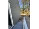 View of the home's side yard with a driveway and trees at 1457 Richland Road Southwest, Atlanta, GA 30310