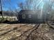 View of the backyard which has mature trees, fencing and a well maintained lawn, which provides an enjoyable area at 1457 Richland Sw Rd, Atlanta, GA 30310