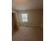 Bedroom featuring neutral walls, carpet, and a window for natural light at 1457 Richland Sw Rd, Atlanta, GA 30310
