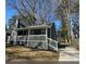Charming home featuring gray siding, white trim, and a cozy porch at 1457 Richland Sw Rd, Atlanta, GA 30310