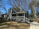 Charming home featuring gray siding, white trim, and a cozy porch at 1457 Richland Sw Rd, Atlanta, GA 30310