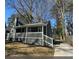 Charming exterior view of the home featuring a covered porch, nice yard, and neutral paint at 1457 Richland Sw Rd, Atlanta, GA 30310