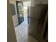 Black front door with arched window, grey rug, and stainless steel refrigerator in the background at 1457 Richland Sw Rd, Atlanta, GA 30310