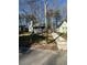Charming home with a covered front porch, well-manicured lawn, and a private driveway nestled between mature trees at 1457 Richland Sw Rd, Atlanta, GA 30310