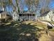 Desirable home boasting a covered porch, chimney, neutral paint and lush front yard at 1457 Richland Sw Rd, Atlanta, GA 30310