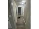 Hallway showcasing neutral paint and vinyl floors leading to various rooms at 1457 Richland Sw Rd, Atlanta, GA 30310
