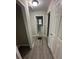 Hallway showing access to other rooms in the home, featuring hard surface floors and neutral paint at 1457 Richland Sw Rd, Atlanta, GA 30310