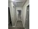 Hallway featuring updated floors and neutral paint at 1457 Richland Sw Rd, Atlanta, GA 30310