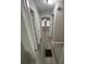 Hallway features vinyl flooring and view into another room at 1457 Richland Sw Rd, Atlanta, GA 30310
